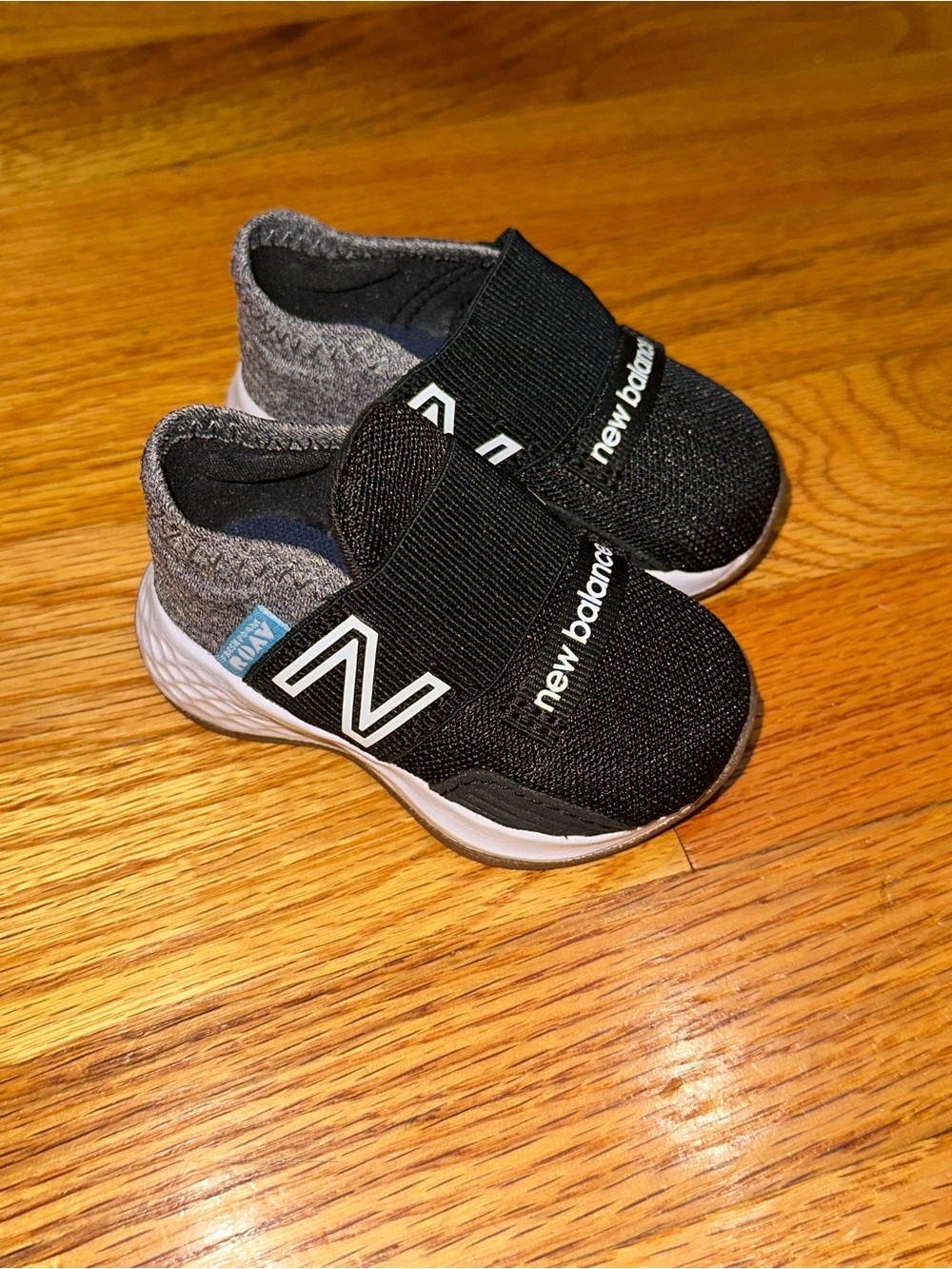 New Balance Black and Gray Infant Slip-On Athletic Shoes
